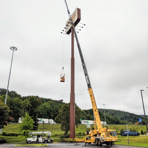 Sign work with crane
