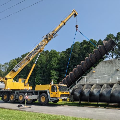 Lifting water plant screw with crane