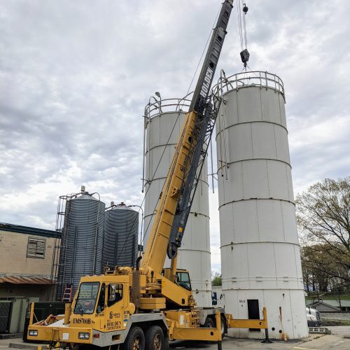 Using crane for disassembly of bolt together silos